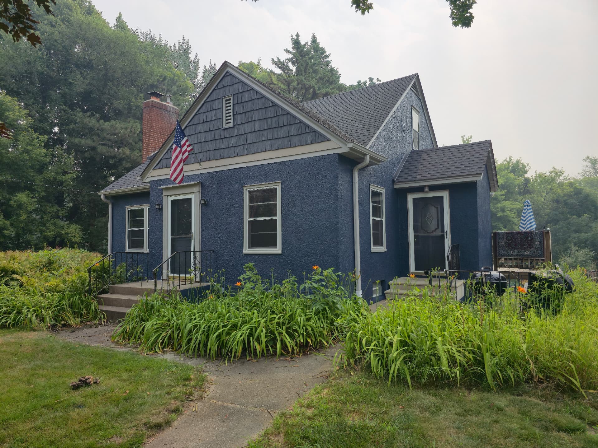 Navy Blue Stucco Cottage Exterior Painting in Shoreview, MN