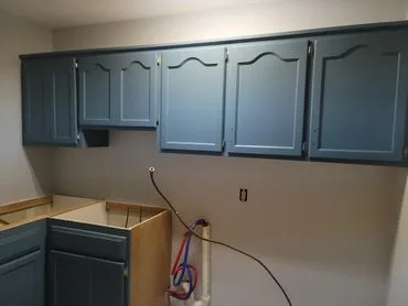 Blue-green kitchen cabinets refinished in Shoreview, Minnesota