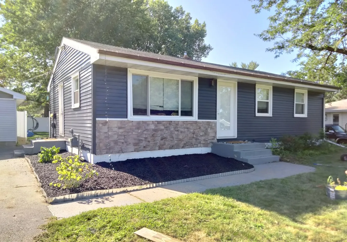 Dark Gray Ranch with Spacious Garage · North Oaks, MN · Full exterior, dark gray, UV-resistant paint Dark Gray Ranch Garage Painting in North Oaks, MN