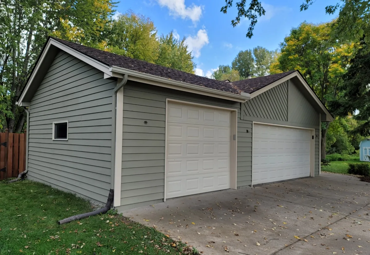 Double Garage with Green Siding · Vadnais Heights, MN · Garage exterior siding, trim, color match Double Garage Green Siding Paint in Vadnais Heights, MN