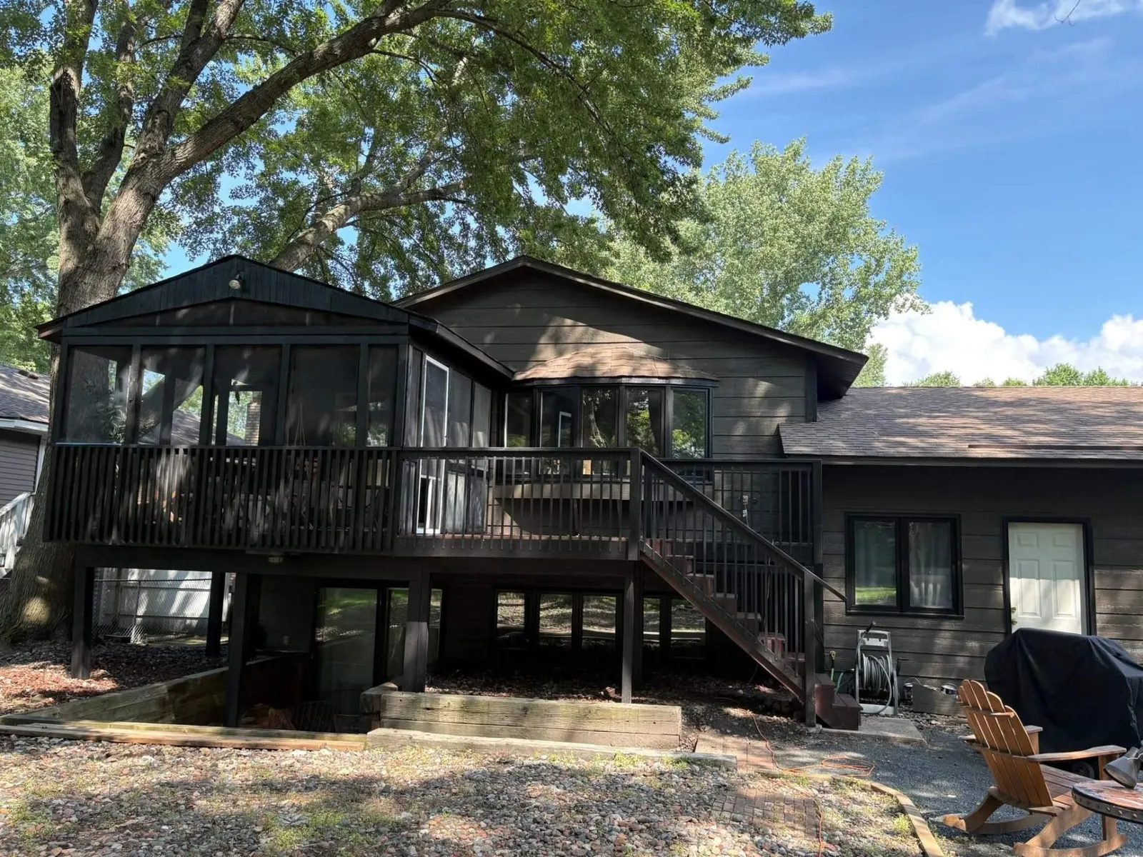 Dark Stained Elevated Deck · Maplewood, MN · Deck boards, railings, posts — dark stain Dark Stained Elevated Deck in Maplewood, MN