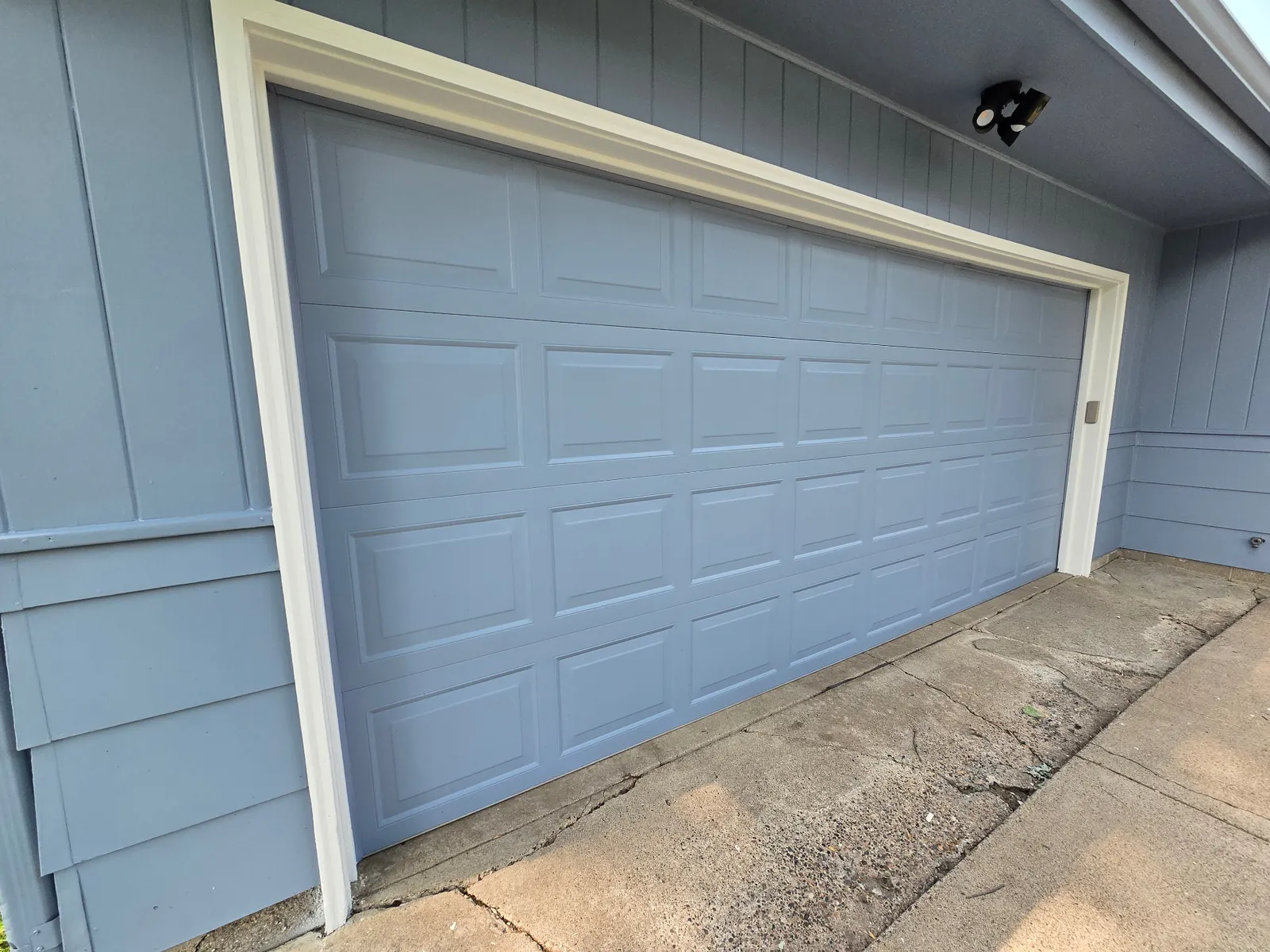 Blue Garage Door and Siding in Blaine, MN