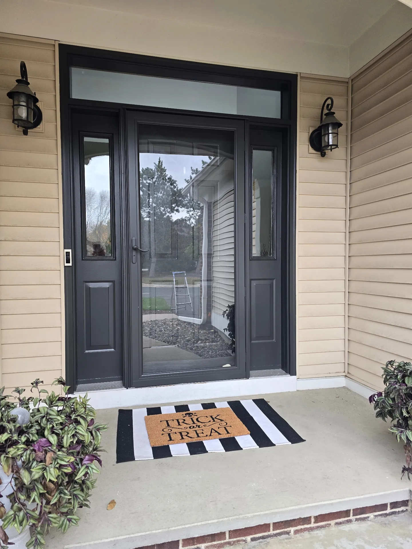 Black Front Door Painting with Glass Sidelights in White Bear Lake, MN