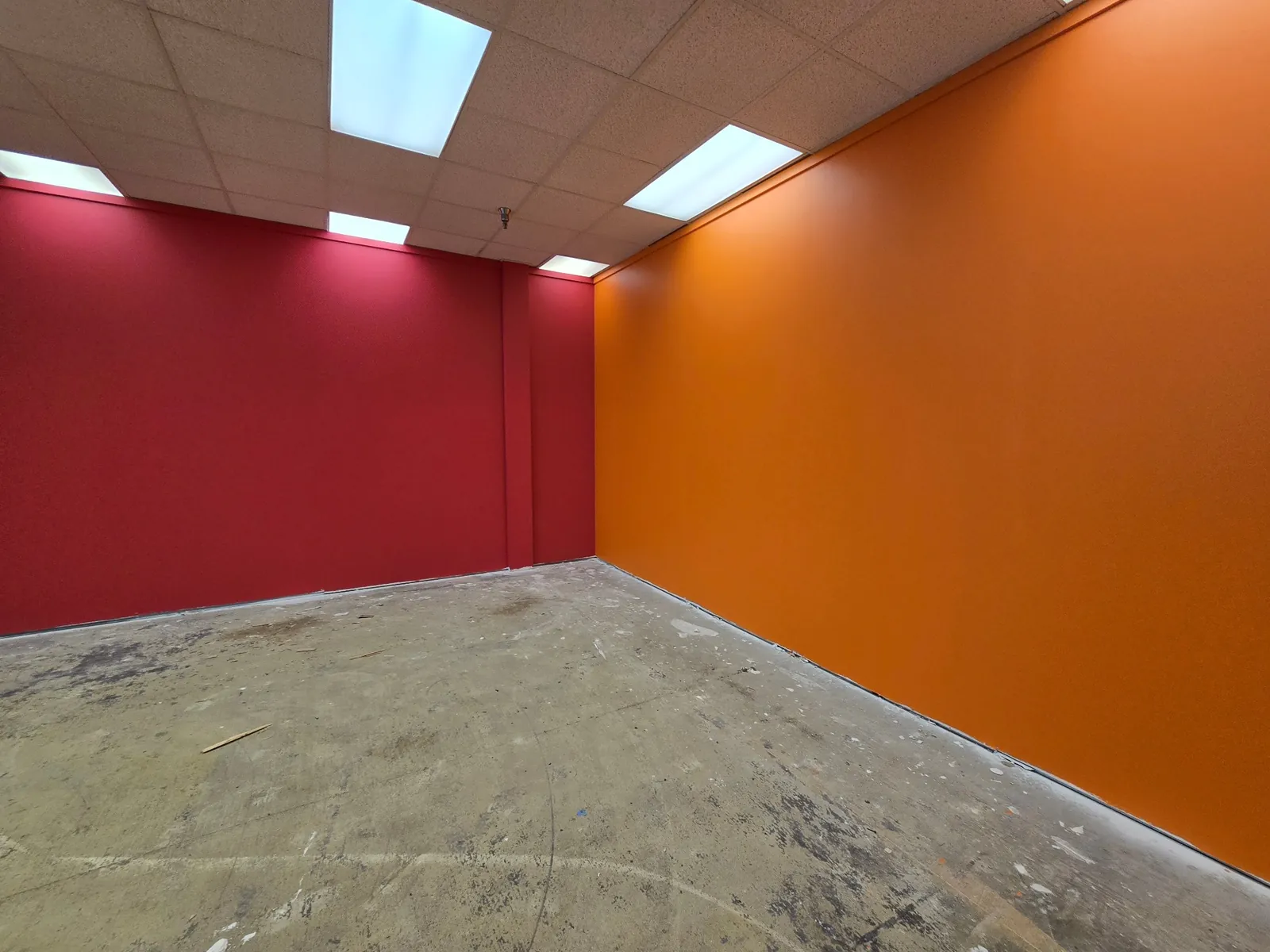 Commercial space with bold red and orange accent walls