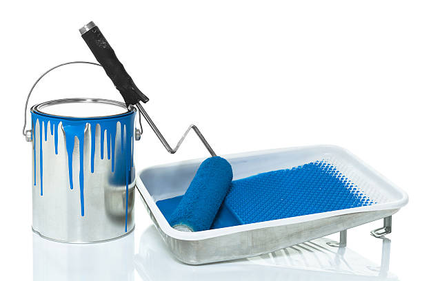 Professional painting supplies including paint bucket and roller used by Advanced Painting Services