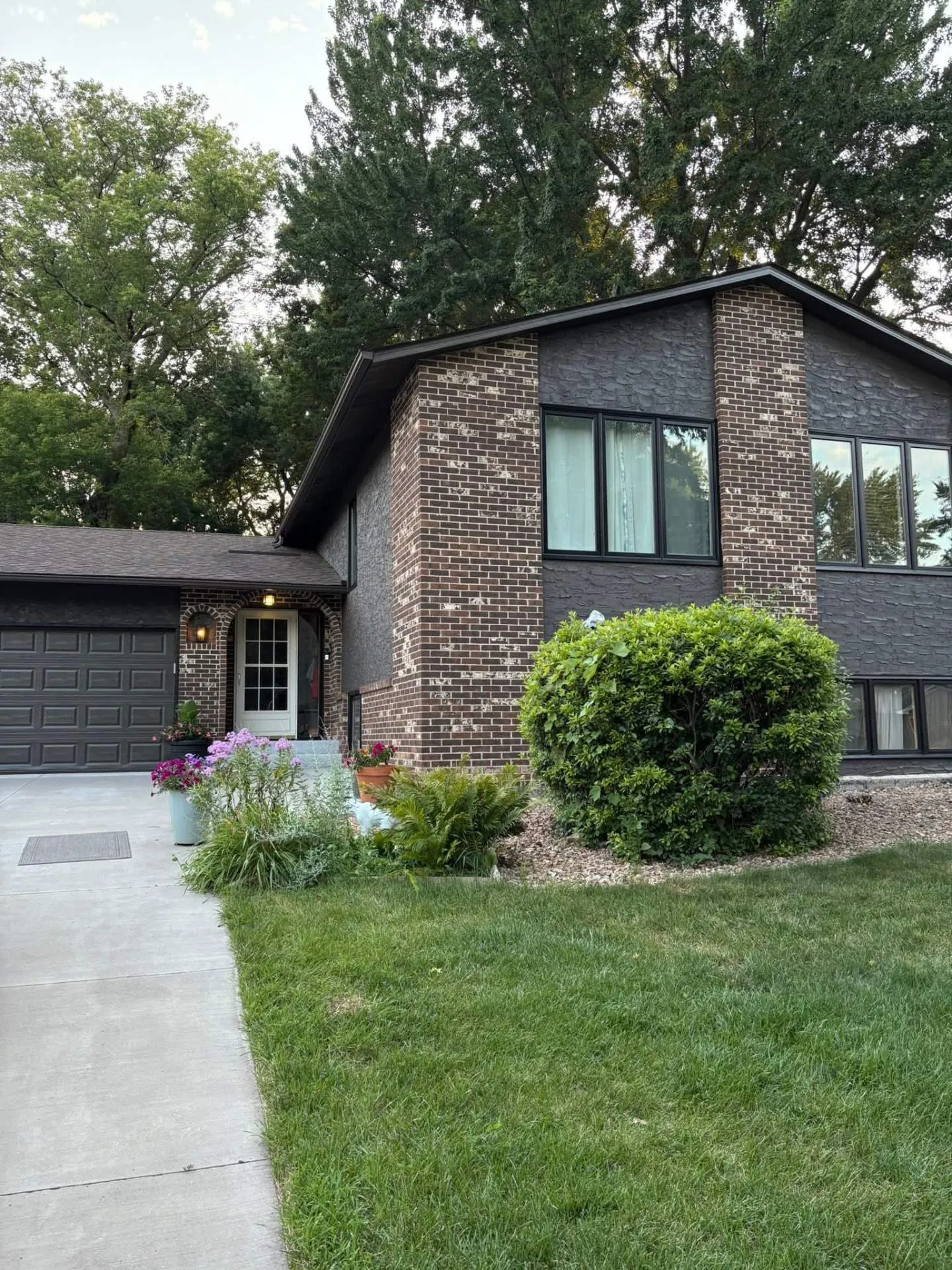Modern Brick Home with Dark Siding Paint in Shoreview, MN